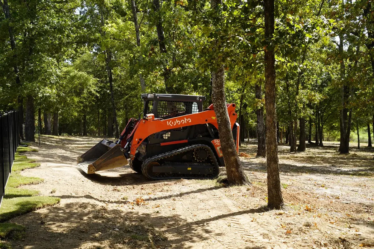 Loader grading a construction site