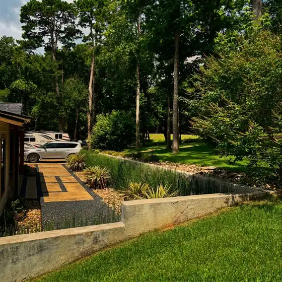 New walkway and retaining wall through a wooded lot
